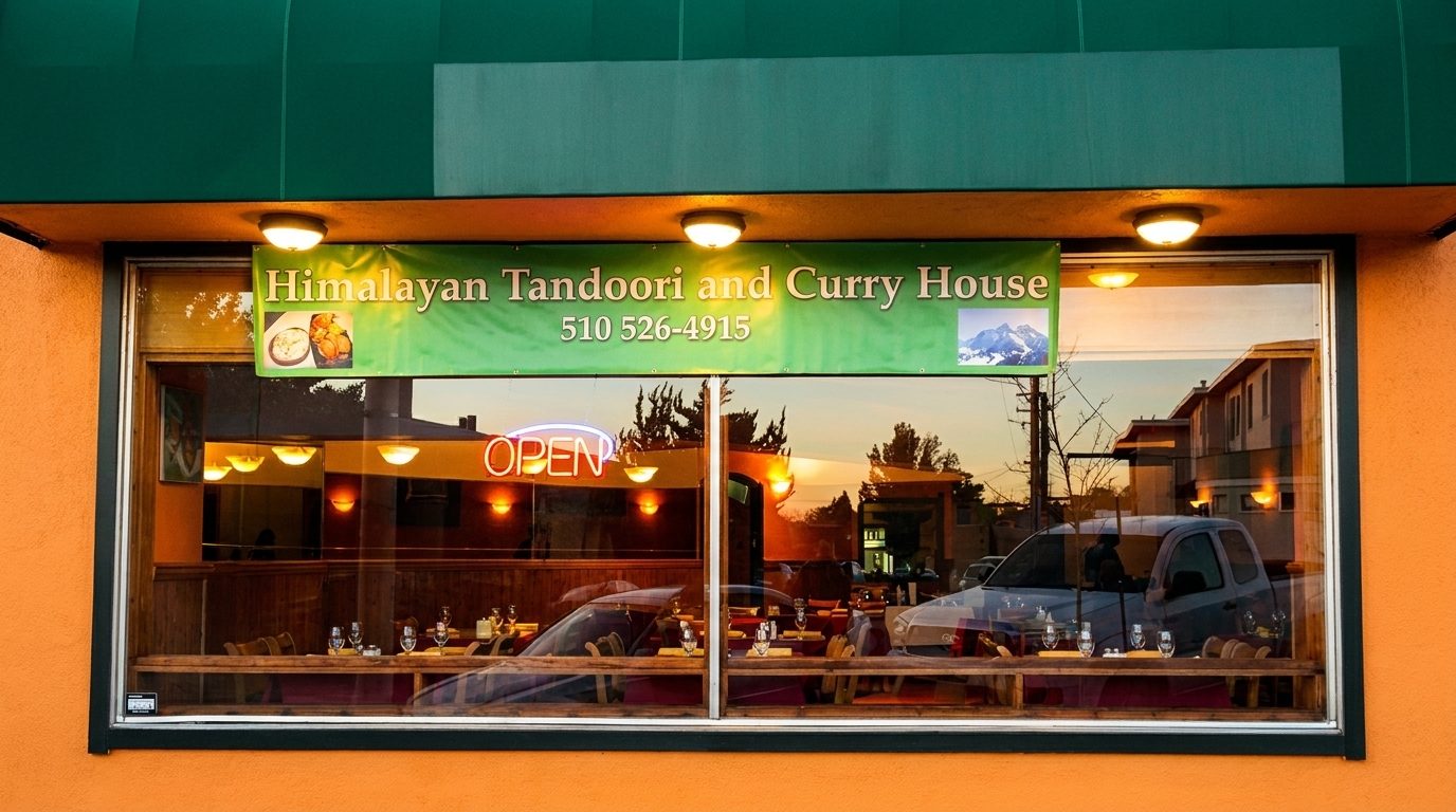 Exterior view of Himalayan Tandoori and Curry House with an "OPEN" sign in the window.