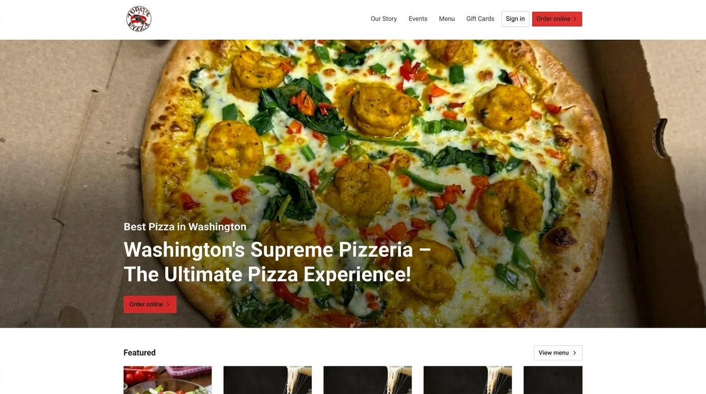 Close-up of a pizza with shrimp, spinach, and red peppers in a cardboard box.