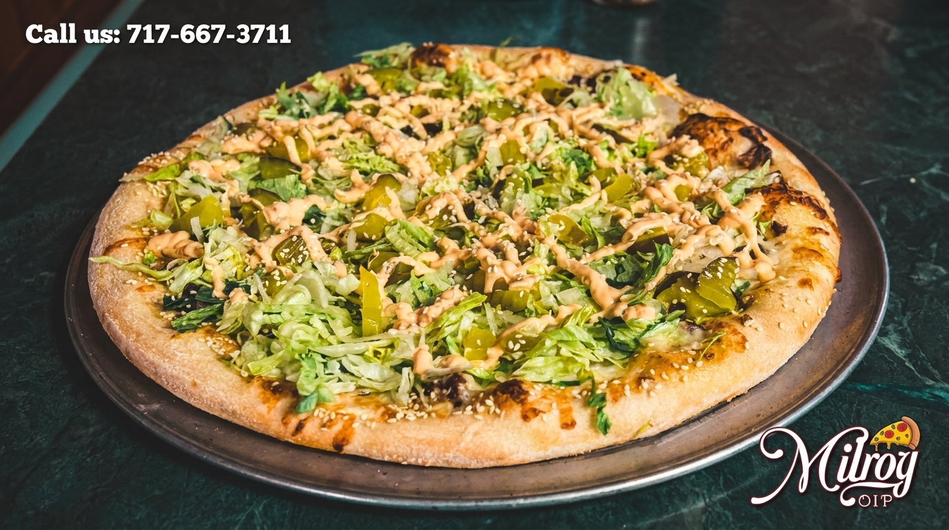 Milroy OIP's Big Mac pizza with shredded lettuce, pickles, sesame seeds, and special sauce.