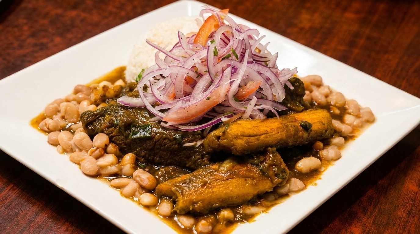 Peruvian seco de res with white beans, rice, and red onion salsa on a white plate.