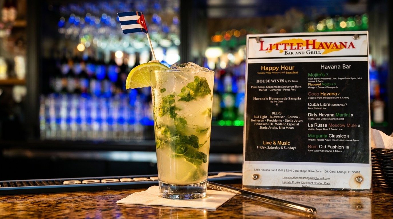 A mojito with a Cuban flag and lime garnish sits on a bar next to a Little Havana menu.