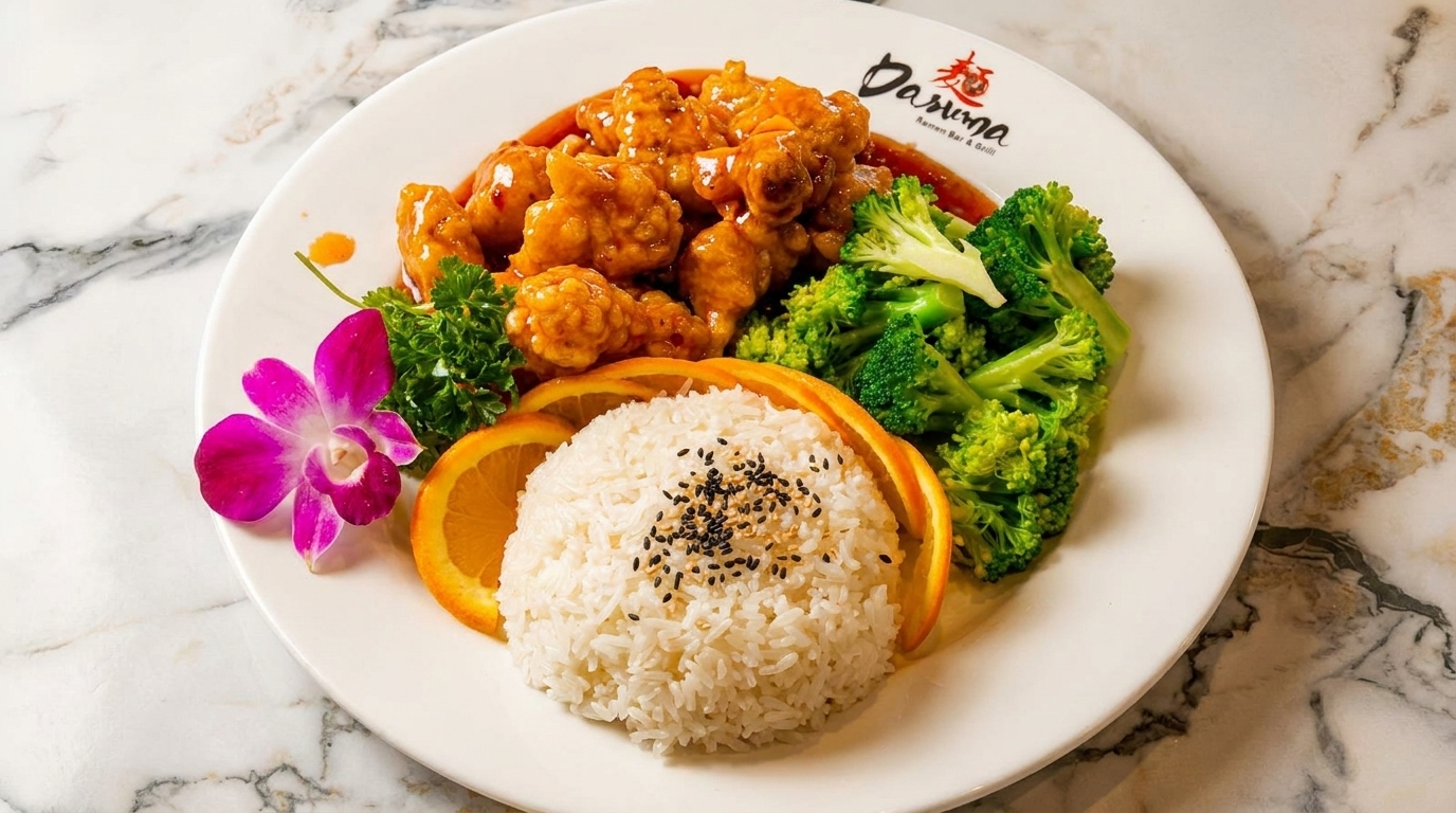 Dasuma Ramen Bar & Grill's orange chicken, rice, broccoli, and orange slices on a white plate.