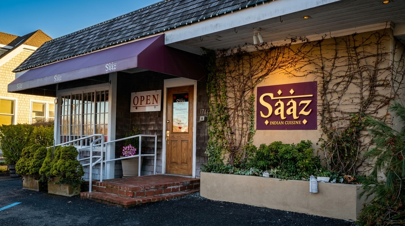 Exterior of Saaz Indian Cuisine restaurant with a purple awning, wooden door, and ivy-covered walls.