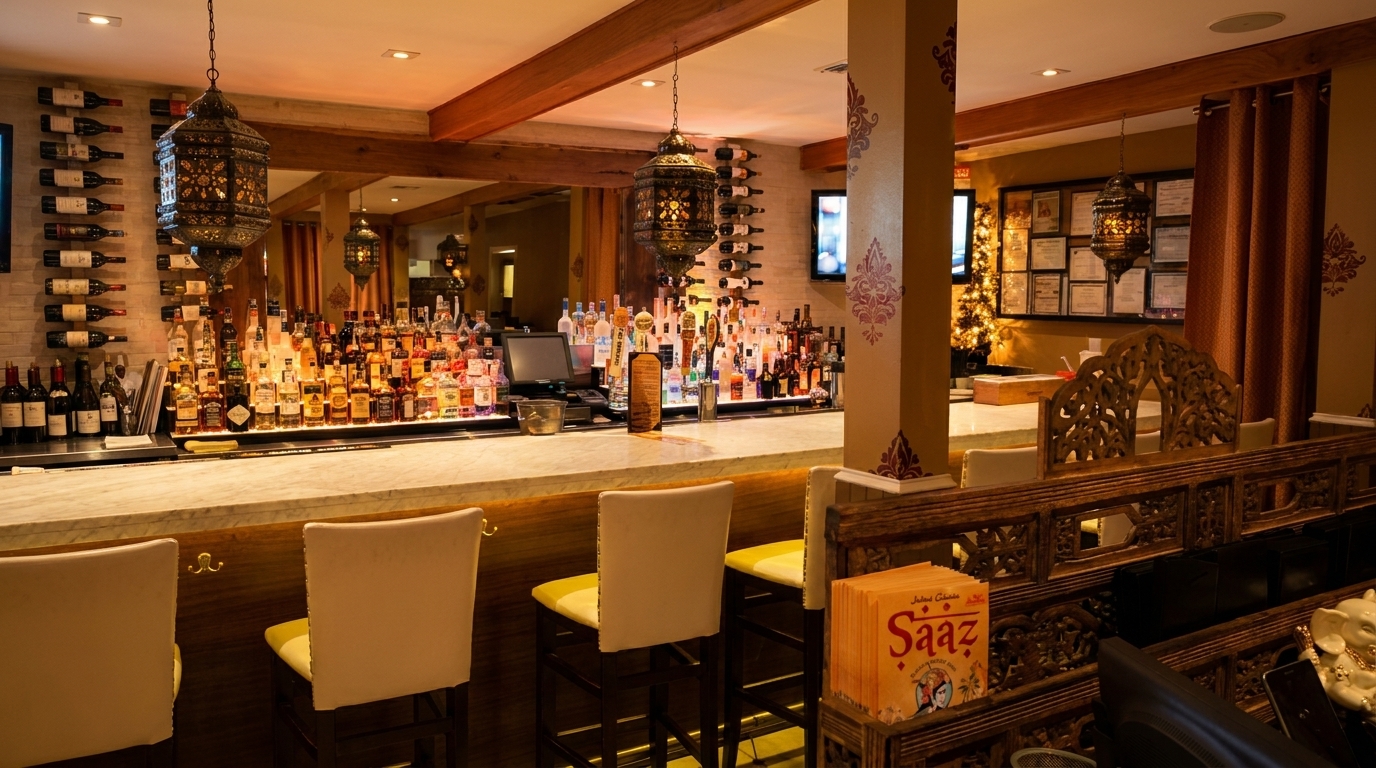 A well-stocked bar with bottles of liquor and wine, featuring ornate hanging lanterns and bar stools.