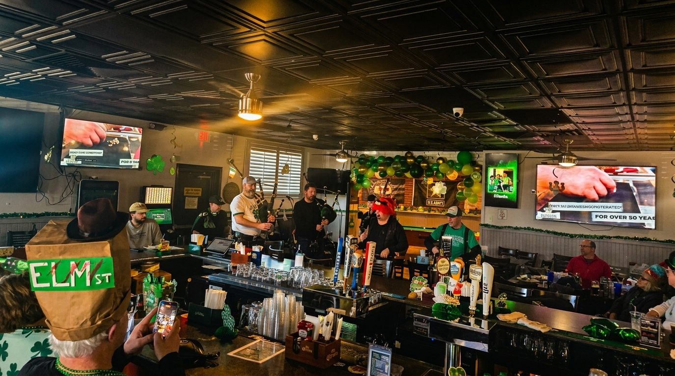 A lively bar scene with people, bagpipers, and St. Patrick's Day decorations, including green balloons.