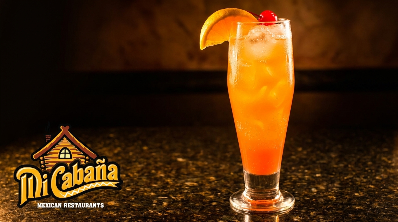 A vibrant orange and red cocktail with ice, garnished with an orange slice and cherry.