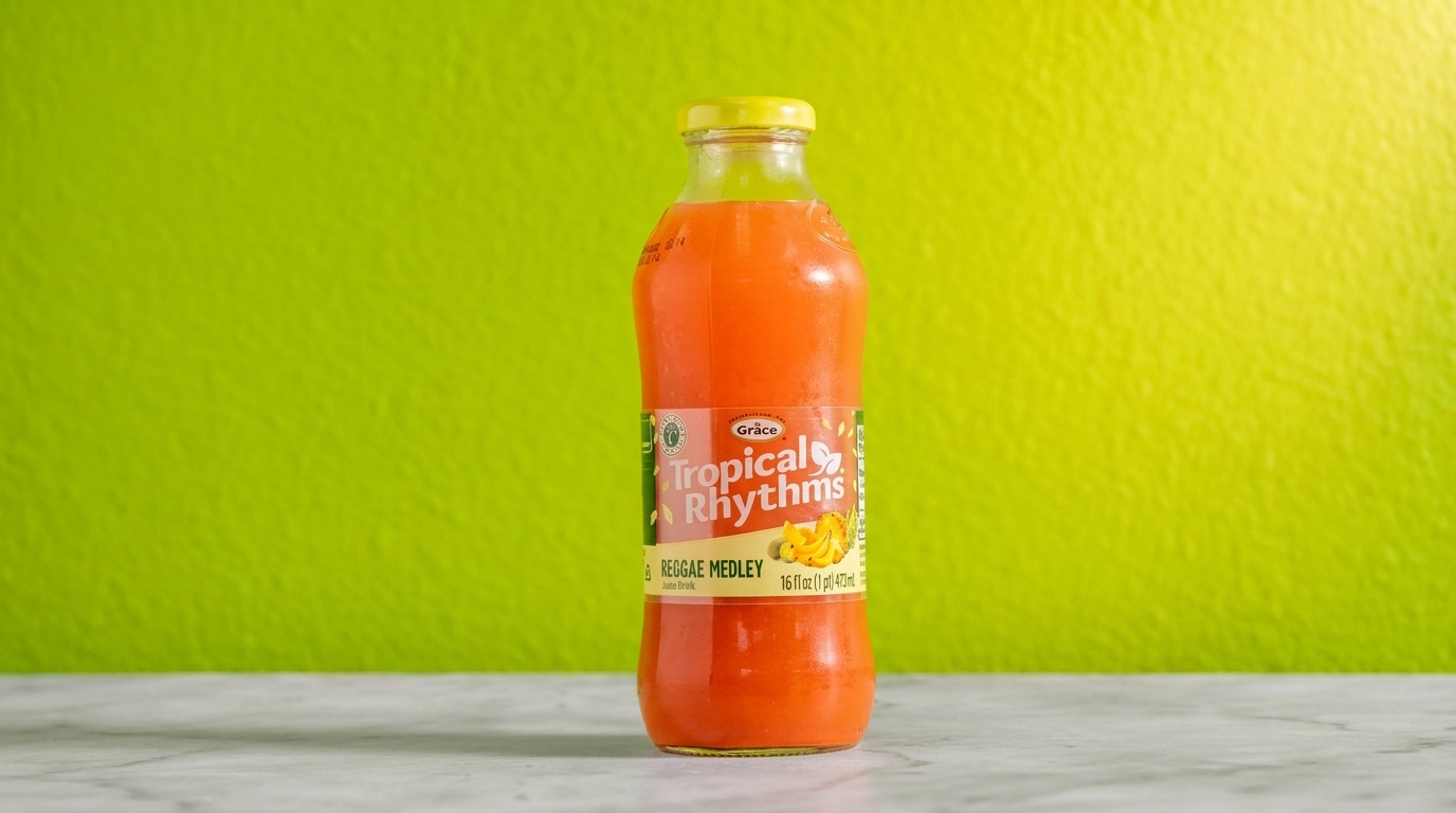 Grace Tropical Rhythms Reggae Medley juice bottle with a yellow cap, against a bright green background.