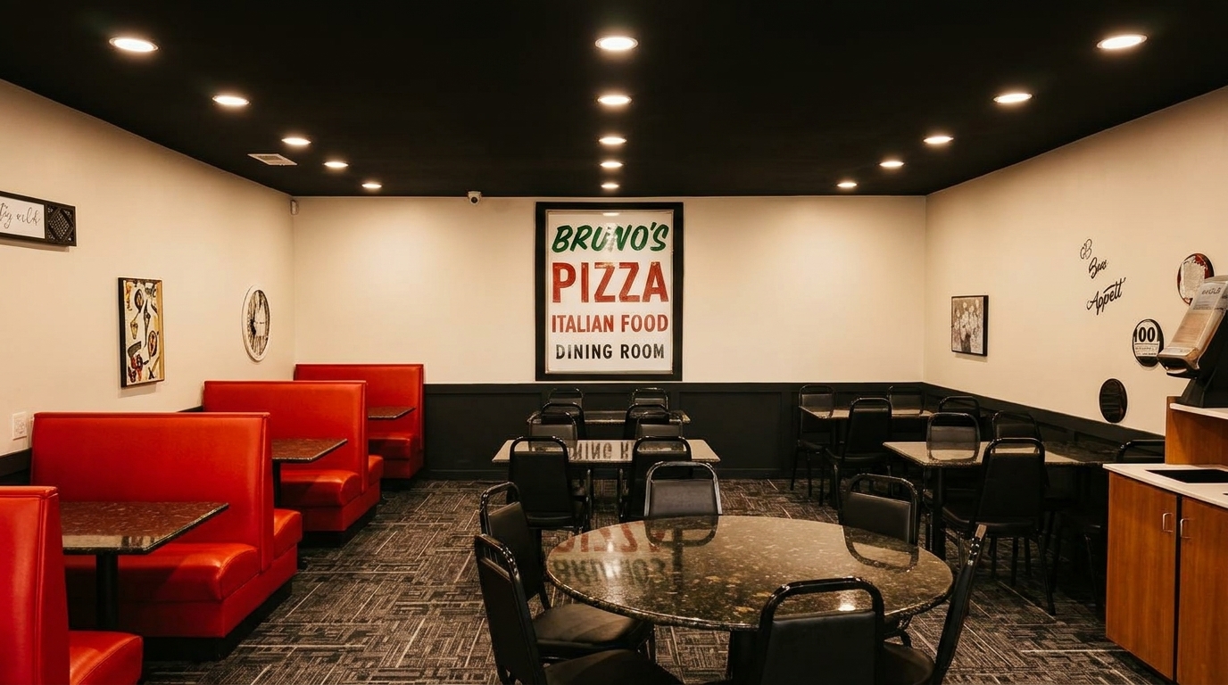 Bruno's Pizza dining room with red booths, black tables, chairs, and a large sign.