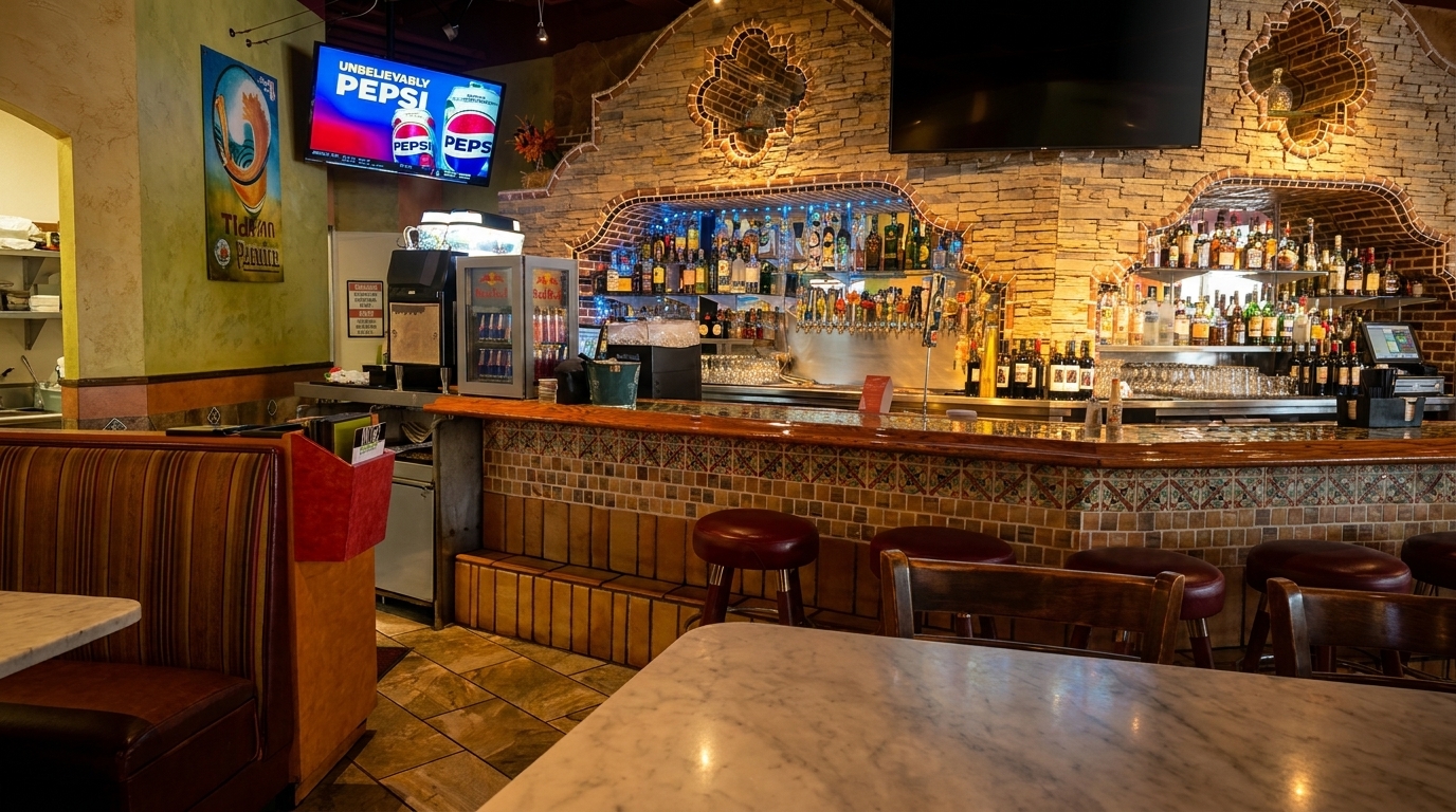 A vibrant restaurant interior with a fully stocked bar, booths, and tables, featuring a Pepsi ad on a TV.