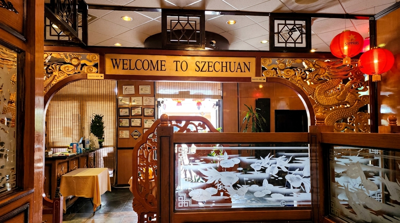 Restaurant entrance with a "Welcome to Szechuan" sign, ornate wooden carvings, and red lanterns.