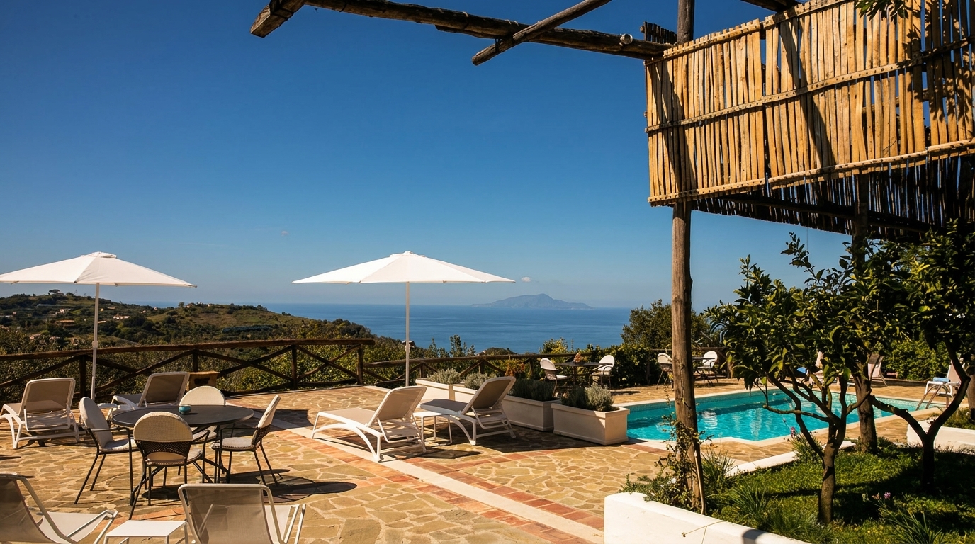 Outdoor patio with lounge chairs, dining tables, umbrellas, a pool, and ocean view.