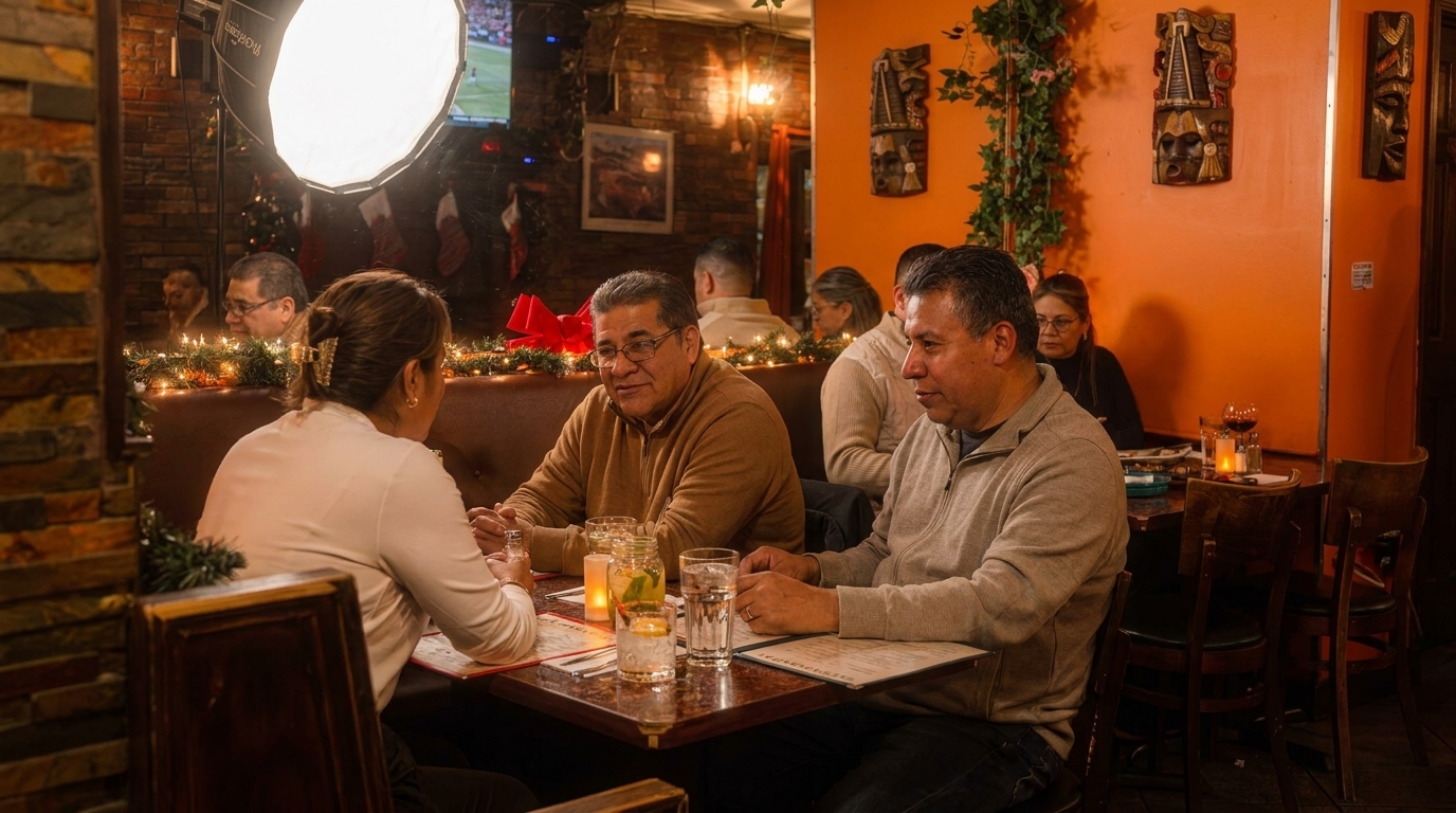 Diners at tables in a warmly lit restaurant with festive garland and cultural decor.