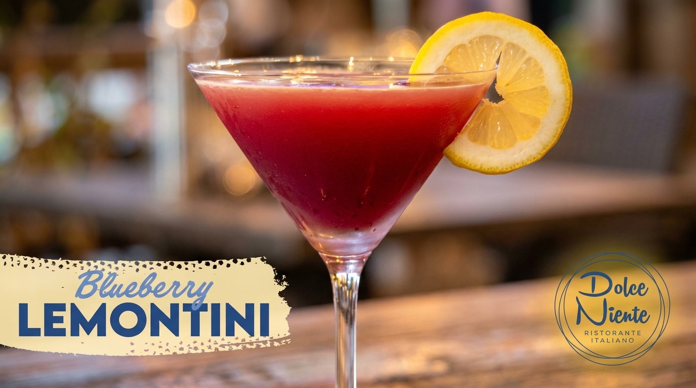 A vibrant red Blueberry Lemontini cocktail in a martini glass, garnished with a lemon slice.