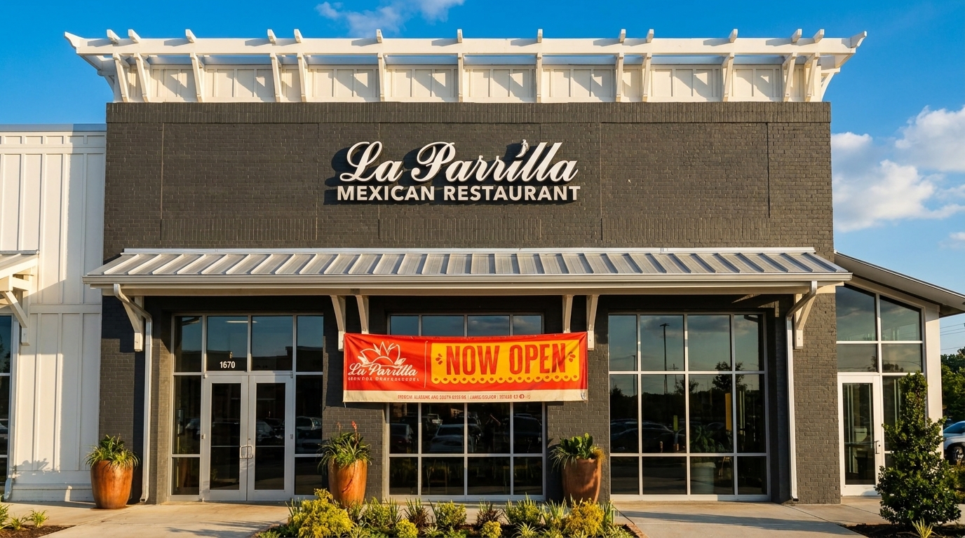 Exterior of La Parrilla Mexican Restaurant with a "Now Open" banner across the front windows.